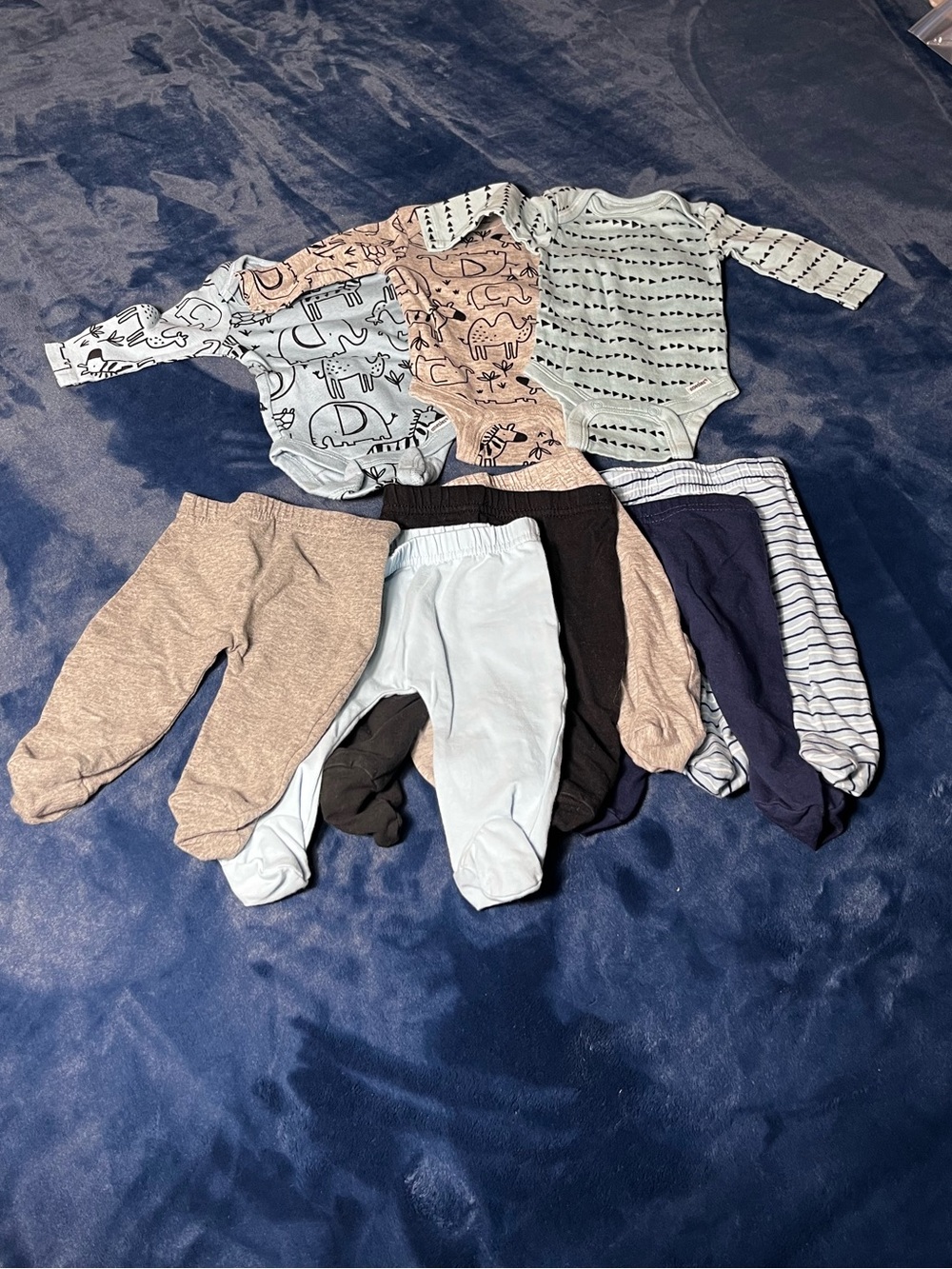 Newborn shirts and pants  9 pc bundle.  3 tops & 6 footed pants